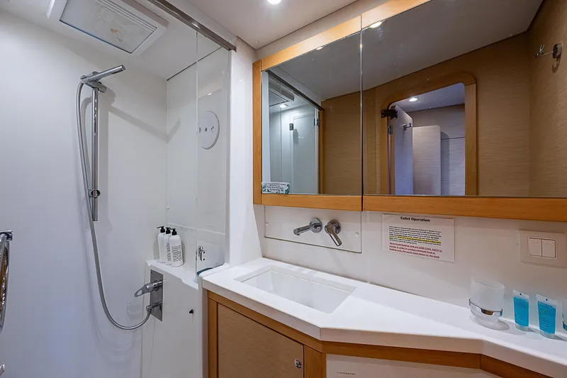 Somewhere Yacht Photos Pics Modern bathroom in 2018 Lagoon 450 yacht with shower and vanity.