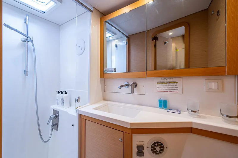 Somewhere Yacht Photos Pics Modern bathroom in 2018 Lagoon 450 yacht with shower and vanity.