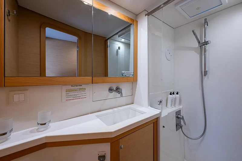 Somewhere Yacht Photos Pics Modern bathroom in 2018 Lagoon 450 yacht with shower and mirror.