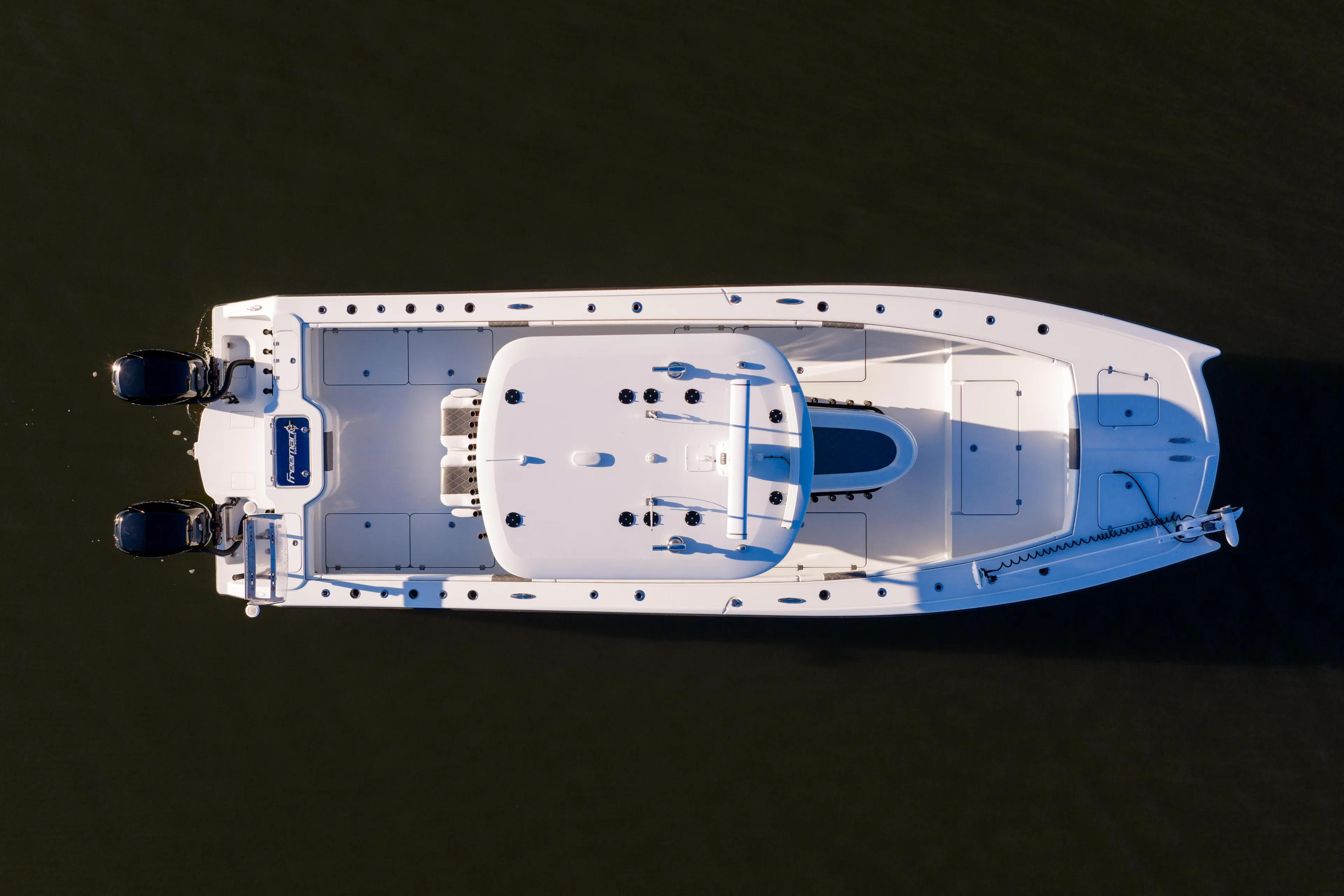  Yacht Photos Pics Aerial view of 2023 Freeman 34VH boat on calm water.