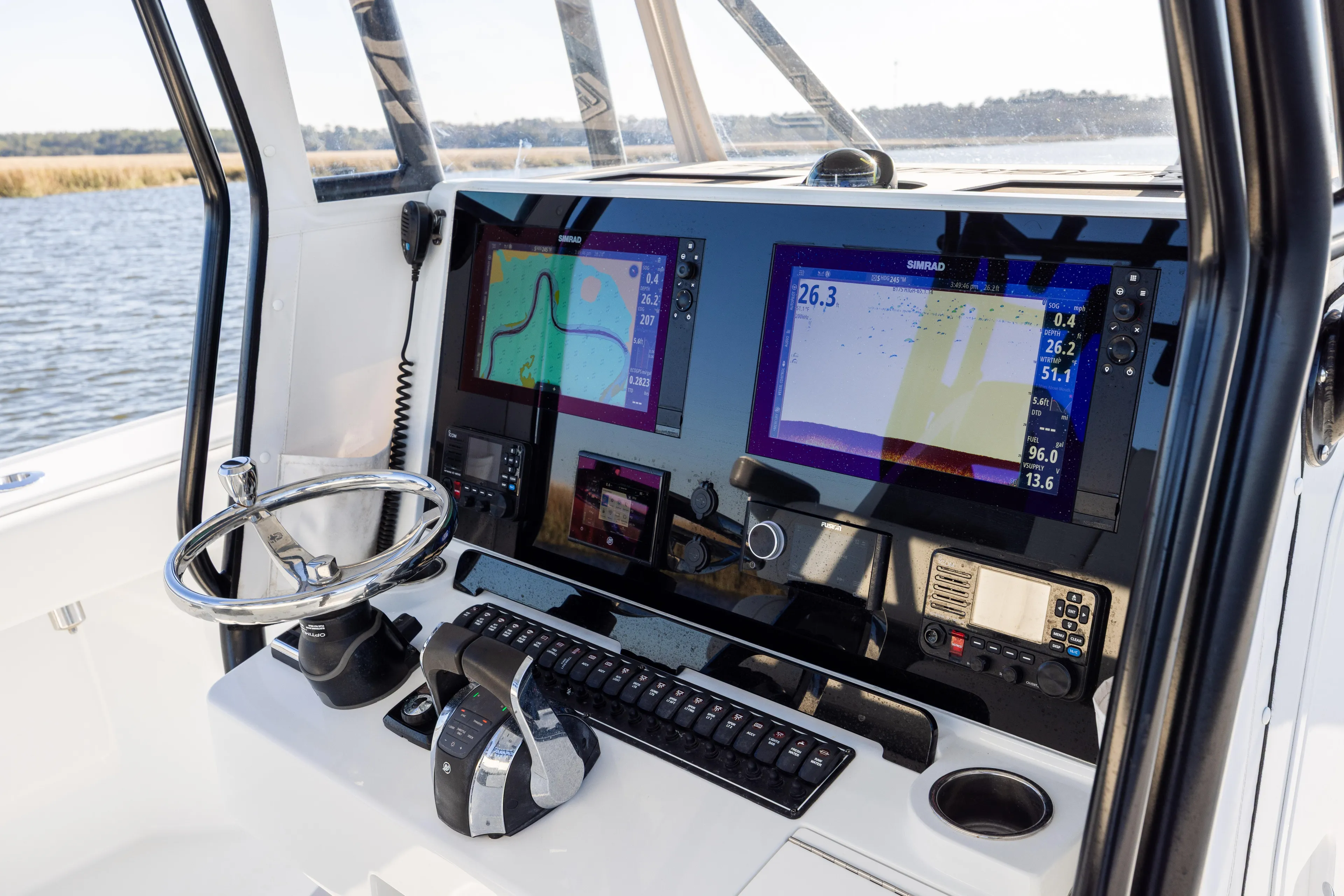  Yacht Photos Pics 2023 Freeman 34VH boat dashboard with navigation screens and controls.