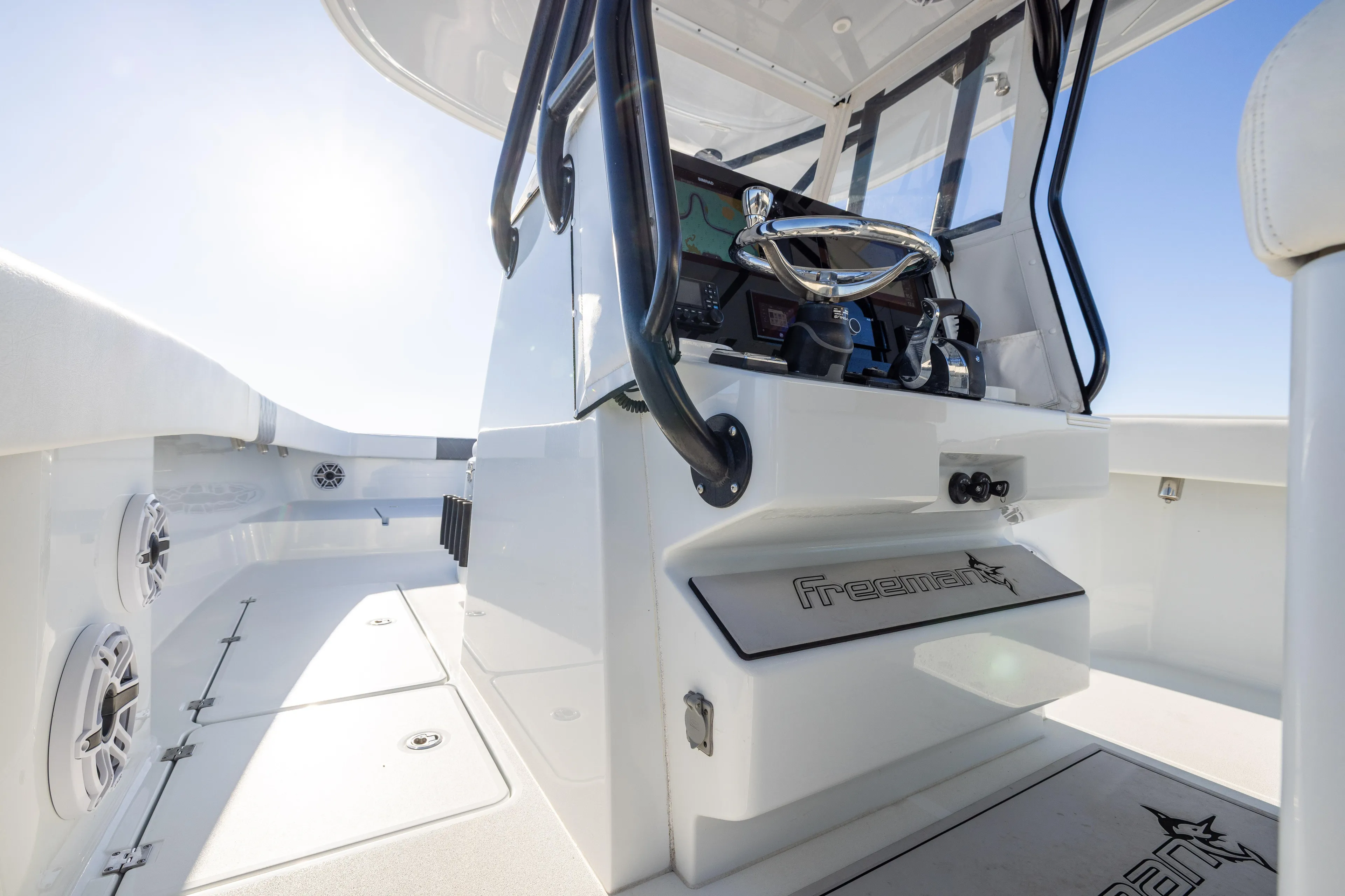  Yacht Photos Pics 2023 Freeman 34VH boat interior with steering console and seating area.