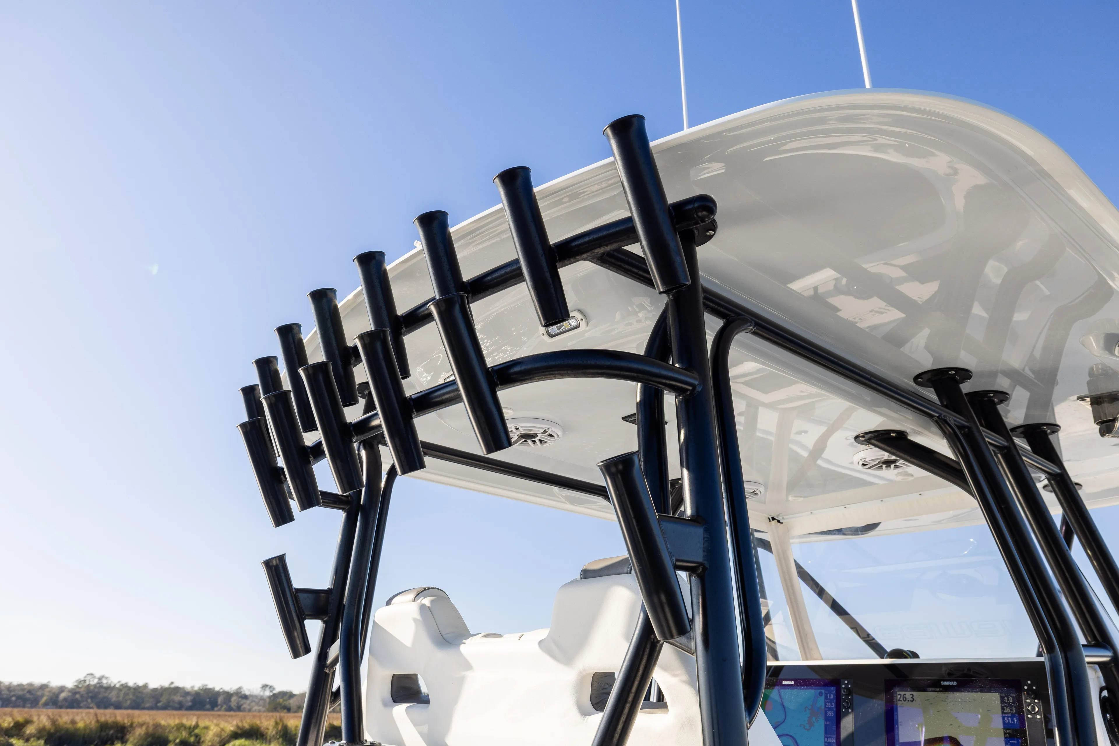  Yacht Photos Pics 2023 Freeman 34VH boat with rod holders and sleek design under clear blue sky.