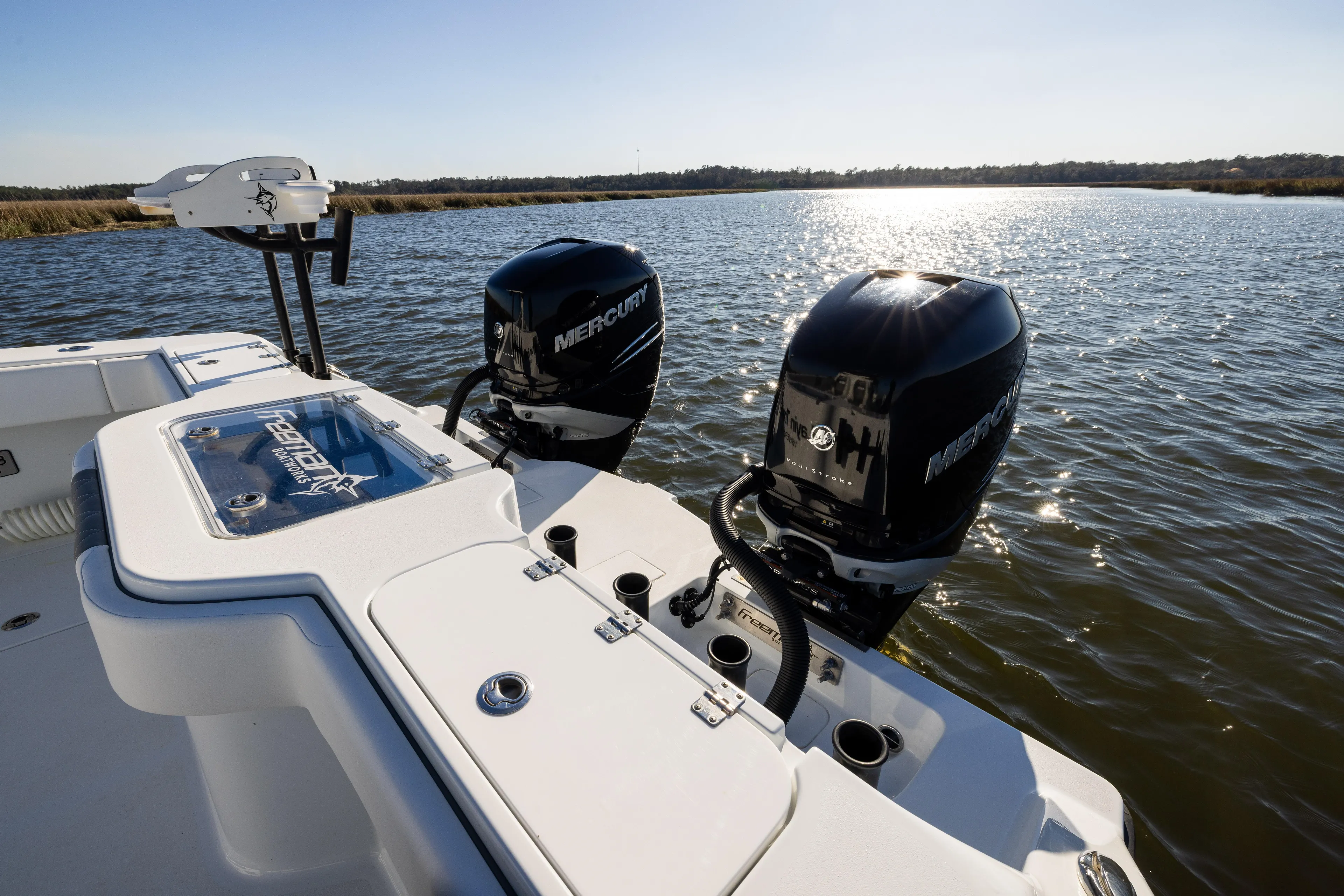  Yacht Photos Pics 2023 Freeman 34VH boat with dual Mercury engines on a sunny lake.