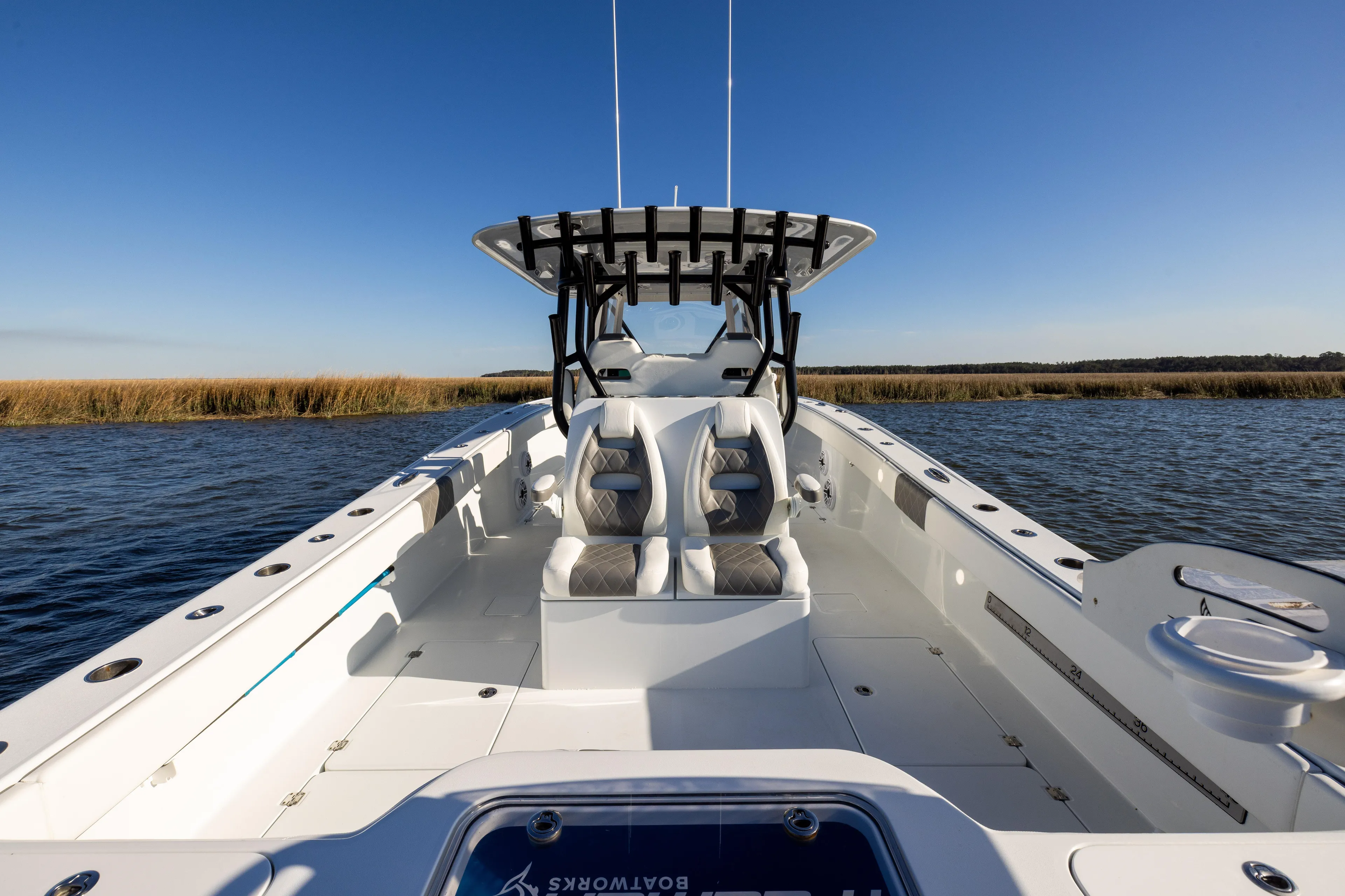  Yacht Photos Pics 2023 Freeman 34VH boat on water, clear sky, spacious deck, modern design.