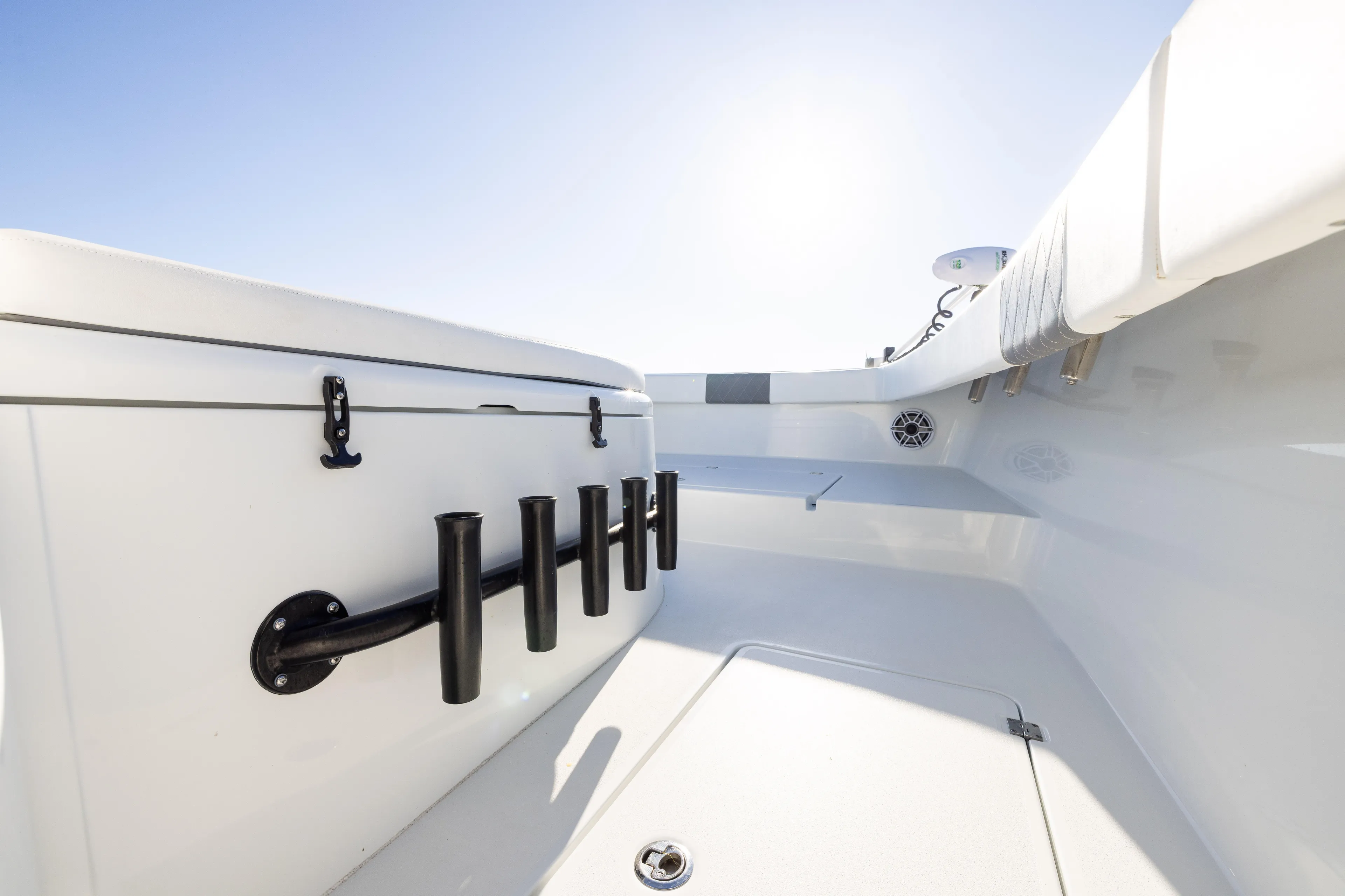  Yacht Photos Pics 2023 Freeman 34VH boat interior with rod holders and sleek white design.