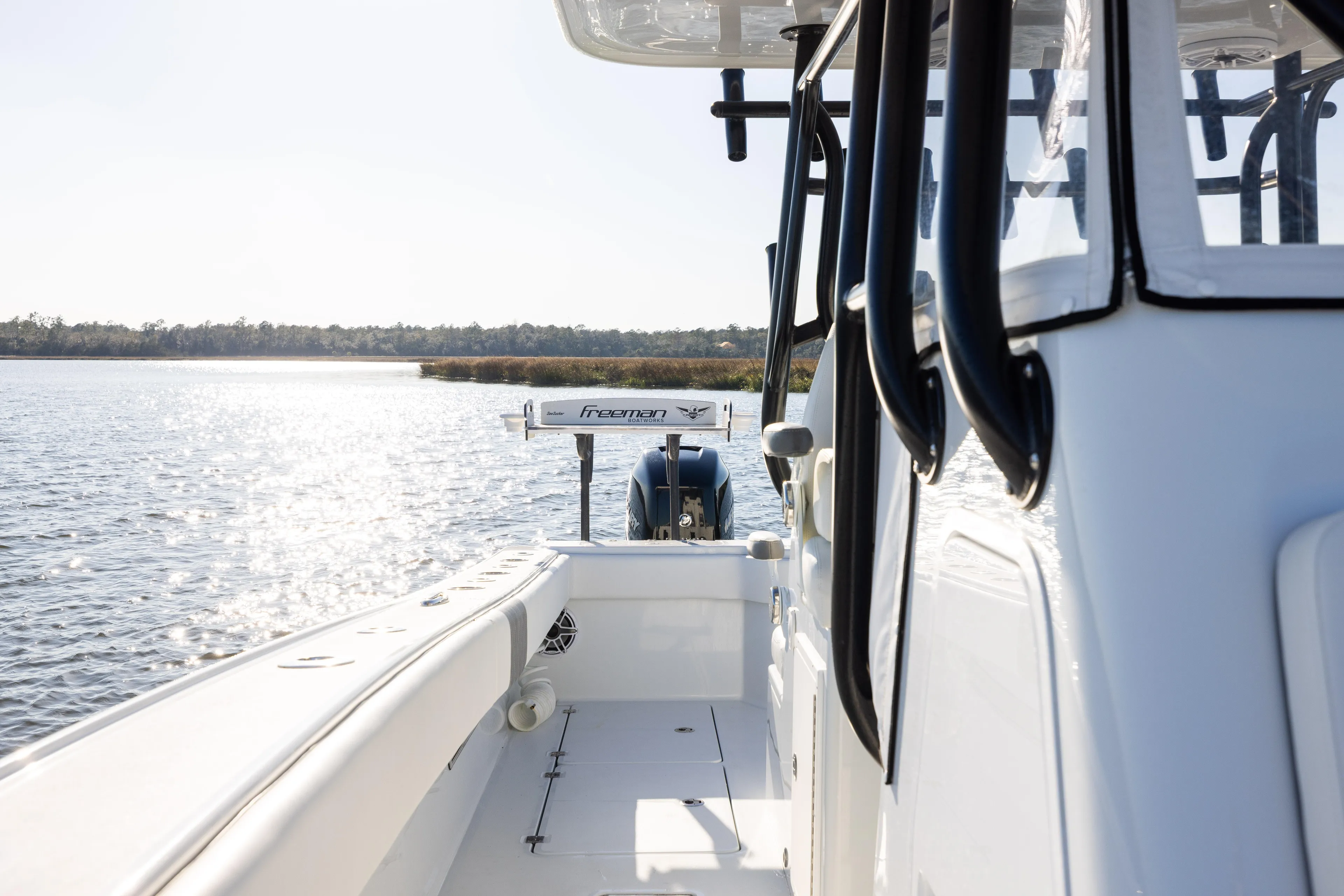  Yacht Photos Pics 2023 Freeman 34VH boat on water, side view, sunny day, scenic background.