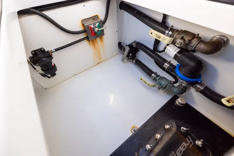  Yacht Photos Pics Engine compartment of a 2023 Freeman 34VH boat, showing pipes and fittings.