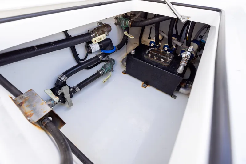  Yacht Photos Pics Engine compartment of 2023 Freeman 34VH boat, showcasing hoses and mechanical components.