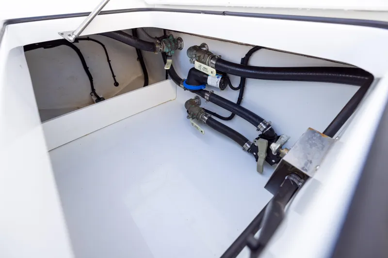  Yacht Photos Pics 2023 Freeman 34VH boat compartment with hoses and valves.