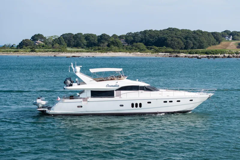 Ocaralia Yacht Photos Pics Luxury 2008 Viking Princess 75 yacht cruising near a scenic coastline.