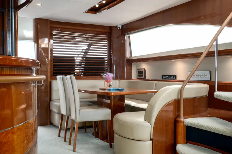 Ocaralia Yacht Photos Pics Luxurious interior of 2008 Viking Princess 75 yacht with elegant dining area and wooden finishes.