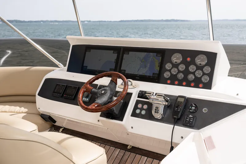Ocaralia Yacht Photos Pics Helm of 2008 Viking Princess 75 yacht with navigation screens and controls.