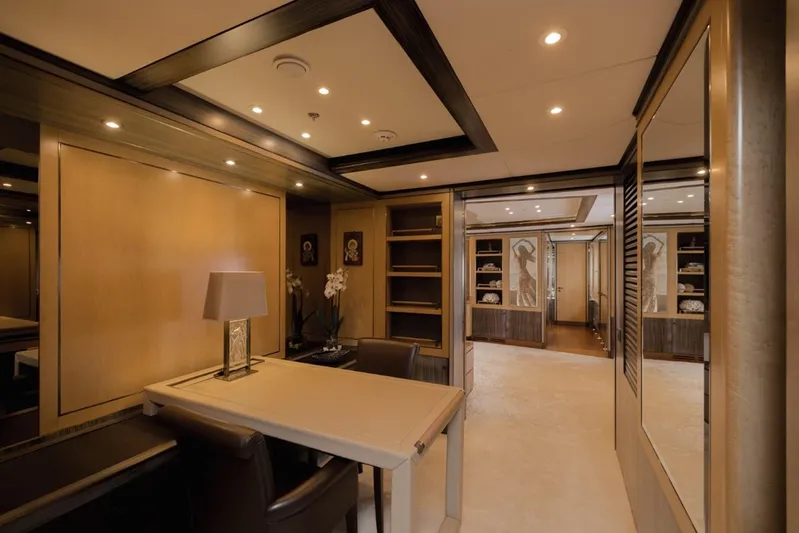 Belle Anna Yacht Photos Pics Luxurious yacht interior with elegant decor, featuring a desk, lamp, and artwork. ISA 500, 2012.