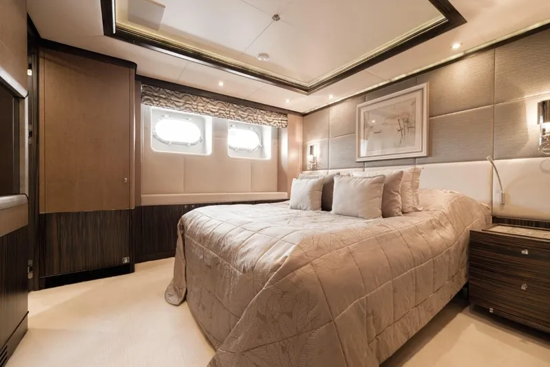 Belle Anna Yacht Photos Pics Luxurious yacht bedroom with elegant decor, featuring a comfortable bed and stylish lighting.