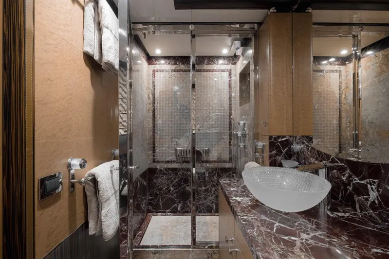 Belle Anna Yacht Photos Pics Luxurious bathroom with glass shower, marble countertop, and modern vessel sink in ISA 500 yacht, 2012.