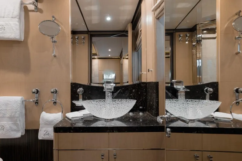 Belle Anna Yacht Photos Pics Luxurious yacht bathroom with glass sink, mirrored walls, and elegant fixtures, ISA 500, 2012 model.