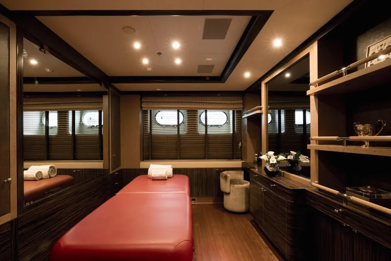 Belle Anna Yacht Photos Pics Luxurious spa room on ISA 500 yacht, featuring massage table and elegant decor, 2012 model.