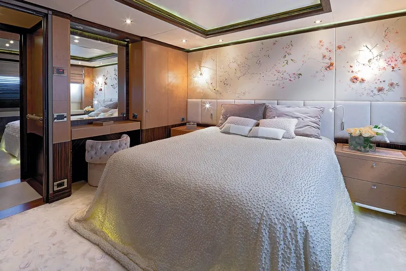 Belle Anna Yacht Photos Pics Luxurious yacht bedroom with elegant decor, floral wall art, and plush bedding, ISA 500, 2012 model.
