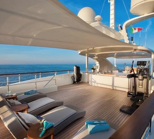 Belle Anna Yacht Photos Pics Luxurious ISA 500 yacht deck with sun loungers and ocean view, 2012 model.
