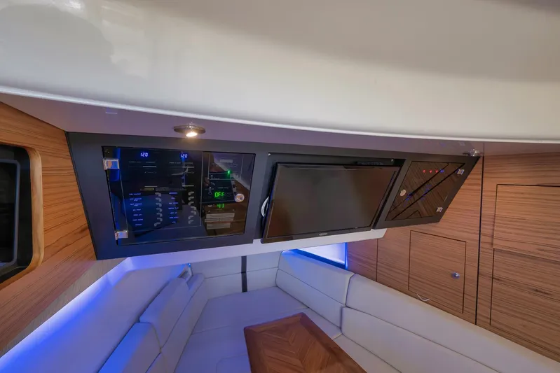  Yacht Photos Pics 2020 Boston Whaler 380 Realm interior with modern control panel and luxurious seating.