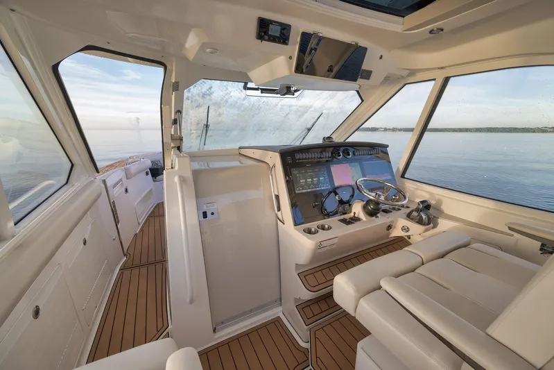 Yacht Photos Pics Interior of 2020 Boston Whaler 380 Realm boat with modern helm and panoramic windows.