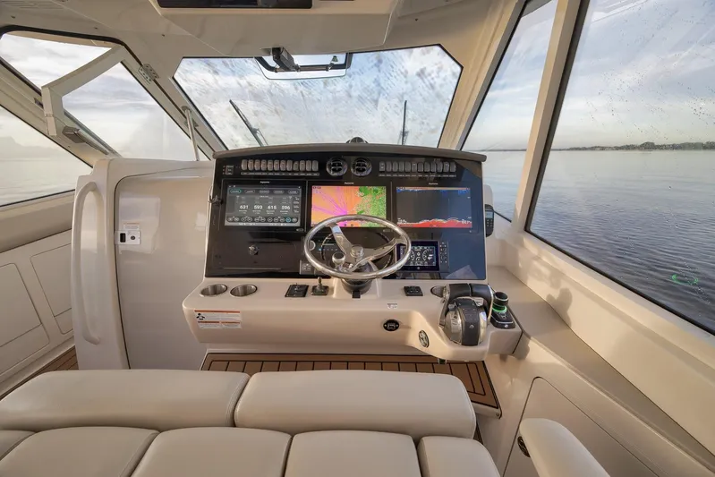  Yacht Photos Pics 2020 Boston Whaler 380 Realm helm with advanced navigation displays and steering wheel.