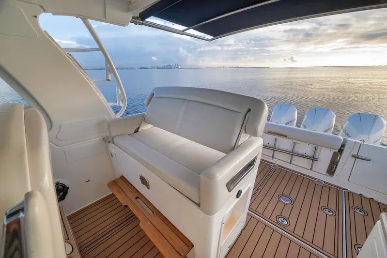  Yacht Photos Pics 2020 Boston Whaler 380 Realm interior with ocean view, featuring comfortable seating and multiple engines.