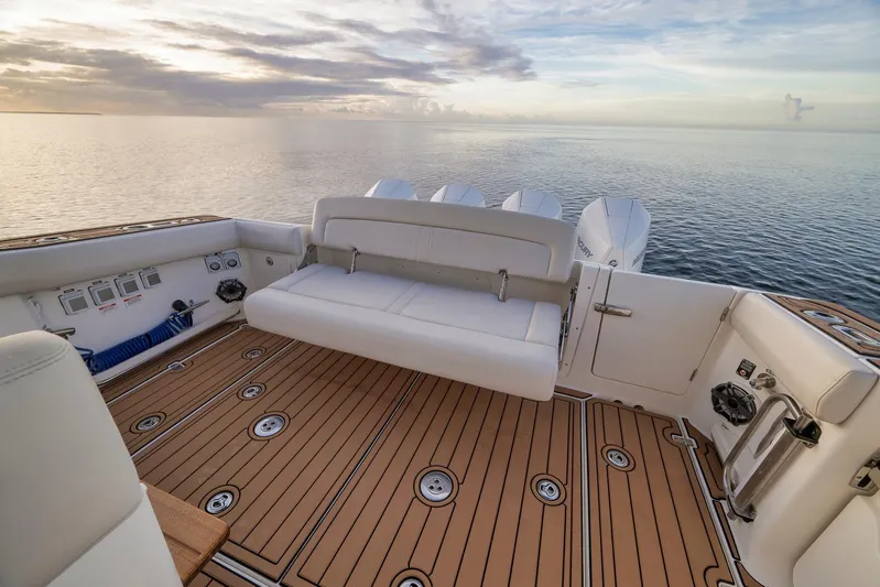  Yacht Photos Pics 2020 Boston Whaler 380 Realm boat interior with seating, ocean view, and sunset.