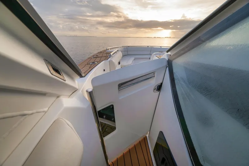  Yacht Photos Pics 2020 Boston Whaler 380 Realm boat interior with ocean view at sunset.