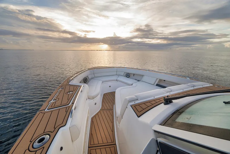  Yacht Photos Pics 2020 Boston Whaler 380 Realm boat at sunset on calm waters.