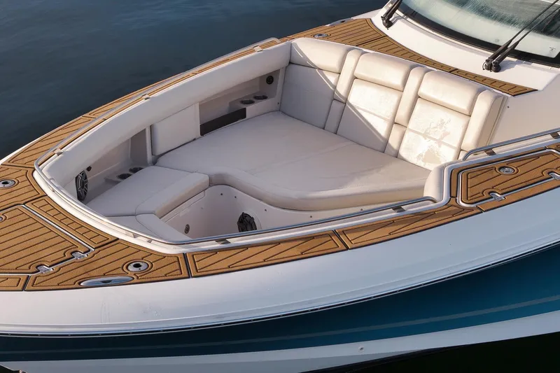  Yacht Photos Pics 2020 Boston Whaler 380 Realm boat with cushioned seating and teak deck accents.