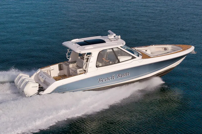  Yacht Photos Pics 2020 Boston Whaler 380 Realm cruising on open water, showcasing sleek design and powerful engines.