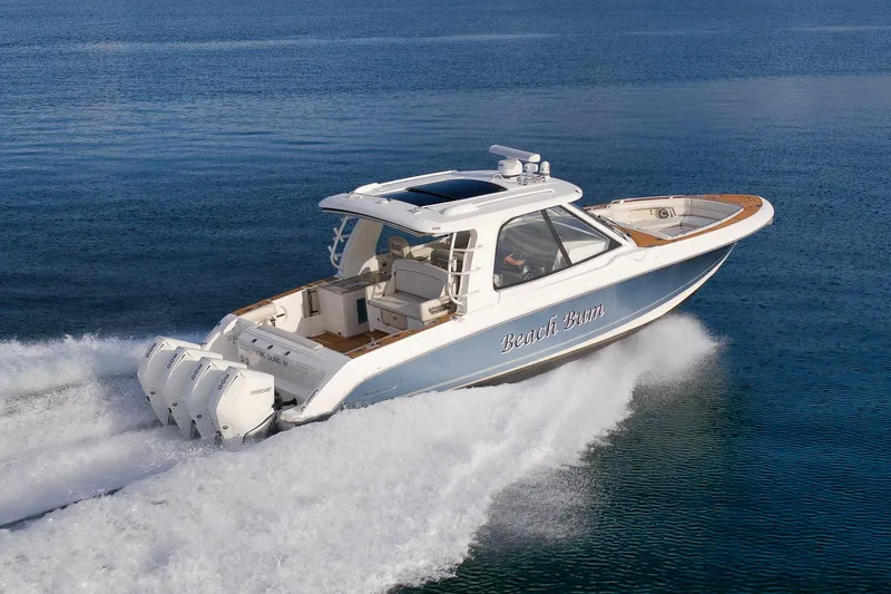  Yacht Photos Pics 2020 Boston Whaler 380 Realm cruising on open water, showcasing sleek design and powerful engines.