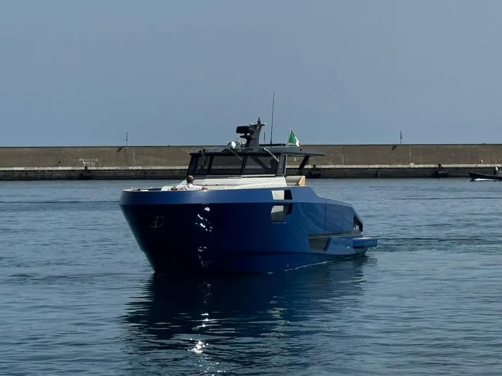  Yacht Photos Pics 2025 Aicon Audace 50 yacht in a harbor, featuring sleek blue design.