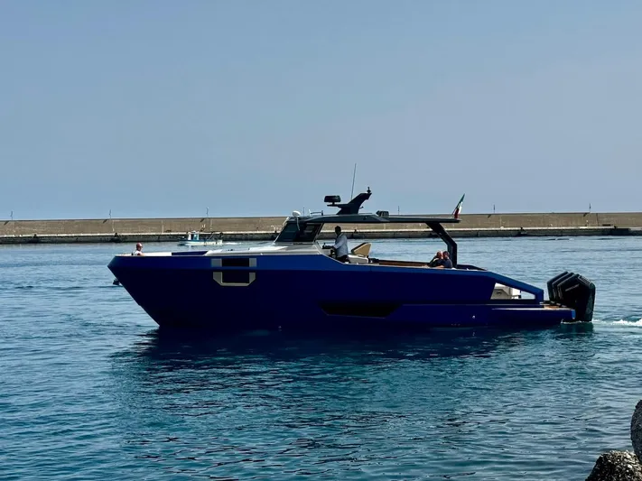  Yacht Photos Pics 2025 Aicon Audace 50 yacht cruising in calm waters near a pier.