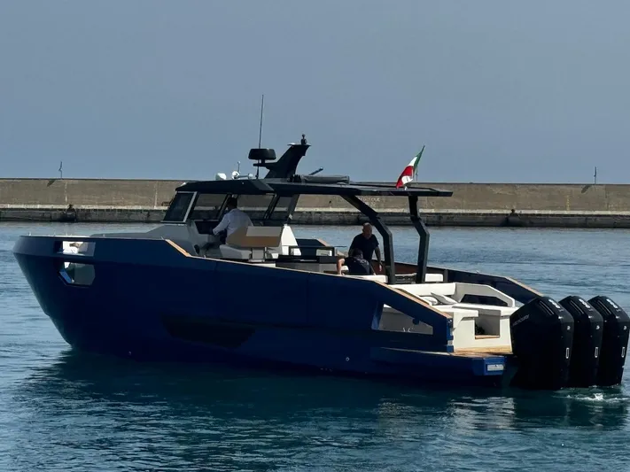  Yacht Photos Pics Aicon Audace 50 yacht, 2025 model, cruising in calm waters near a breakwater.