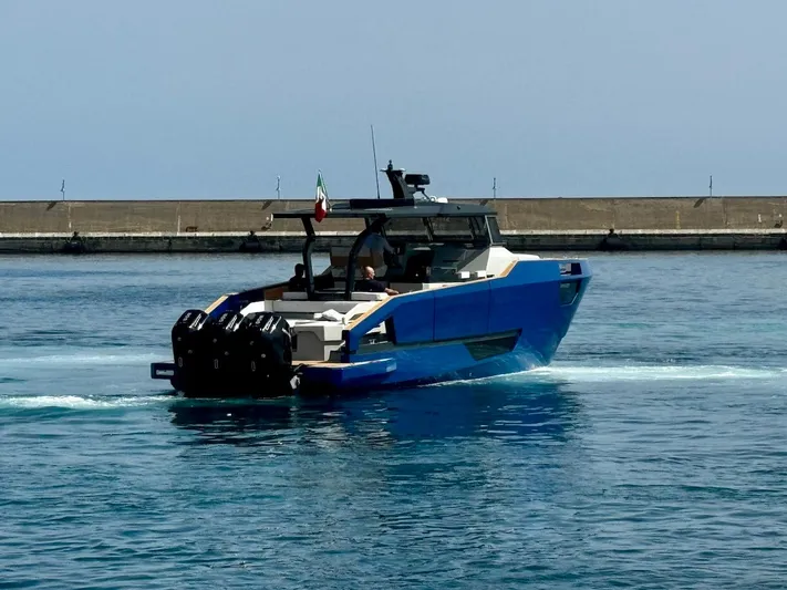  Yacht Photos Pics Aicon Audace 50 yacht, 2025 model, cruising in calm waters near a breakwater.