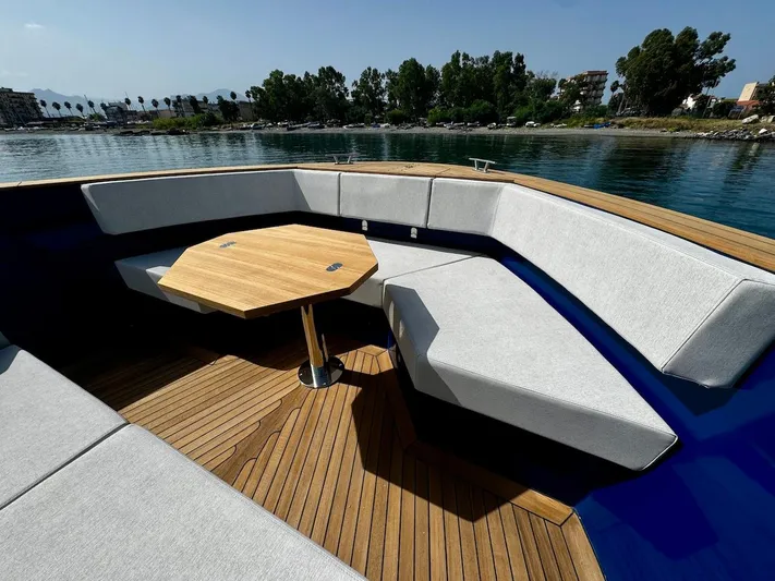  Yacht Photos Pics Luxurious 2025 Aicon Audace 50 yacht with elegant seating and wooden deck.