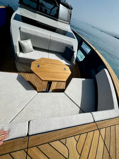  Yacht Photos Pics Luxurious 2025 Aicon Audace 50 yacht with elegant seating and wooden deck.
