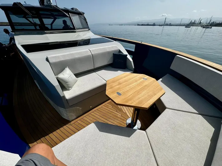  Yacht Photos Pics 2025 Aicon Audace 50 yacht with elegant deck seating and wooden table.