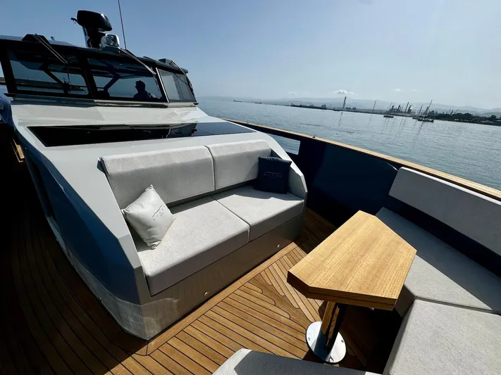  Yacht Photos Pics Luxurious 2025 Aicon Audace 50 yacht deck with modern seating and wooden table.