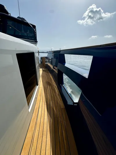  Yacht Photos Pics 2025 Aicon Audace 50 yacht with sleek design and wooden deck, cruising on a sunny day.