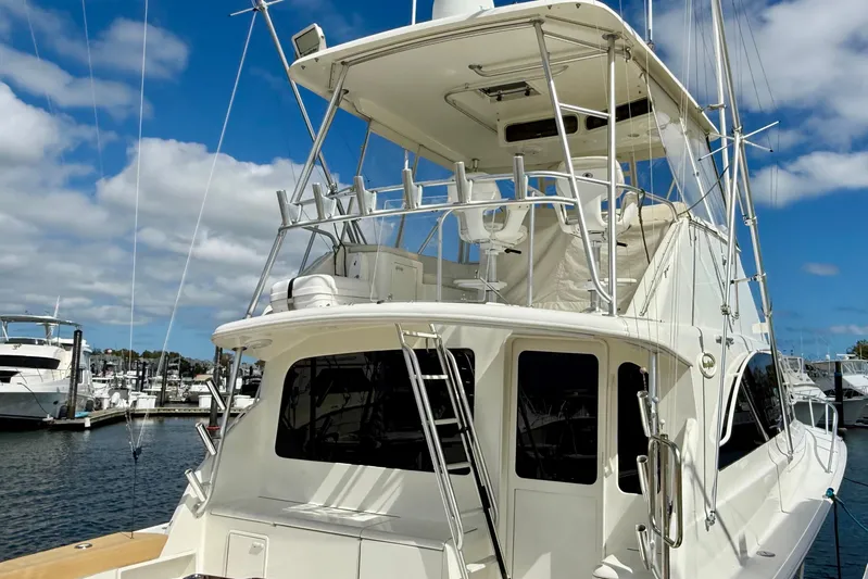  Yacht Photos Pics 2000 Ocean Yachts 48 docked at marina under blue sky.