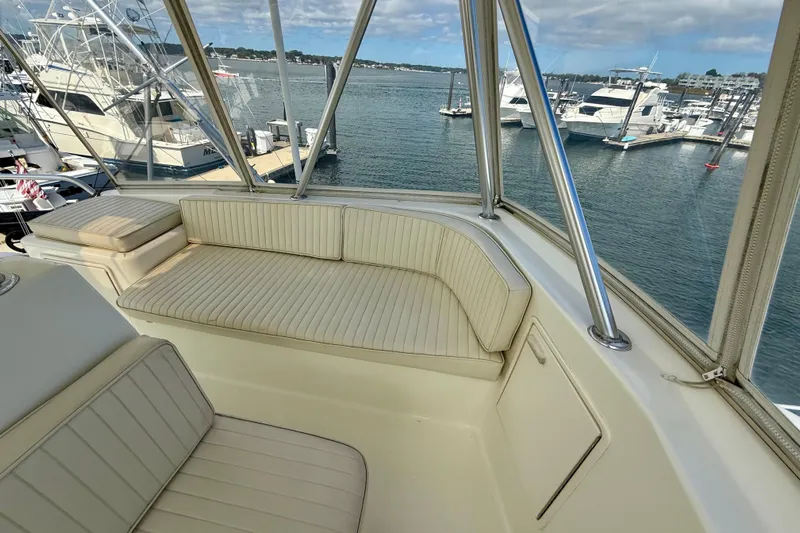  Yacht Photos Pics Luxurious seating area on a 2000 Ocean Yachts 48, overlooking a marina.