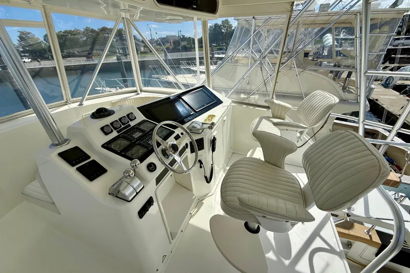 Yacht Photos Pics Cockpit of 2000 Ocean Yachts 48, featuring modern controls and plush seating.