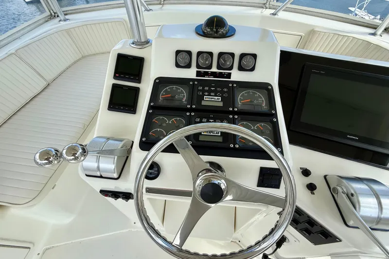  Yacht Photos Pics Helm of 2000 Ocean Yachts 48 with gauges, steering wheel, and navigation equipment.