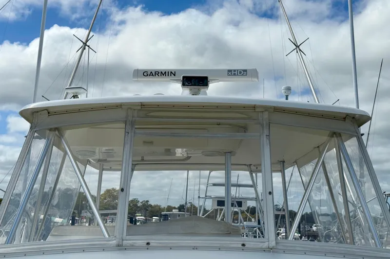  Yacht Photos Pics Ocean Yachts 48, 2000 model, featuring Garmin xHD2 radar, docked under cloudy sky.