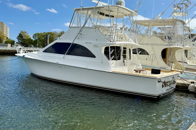  Yacht Photos Pics 2000 Ocean Yachts 48 model docked in a marina under a clear blue sky.
