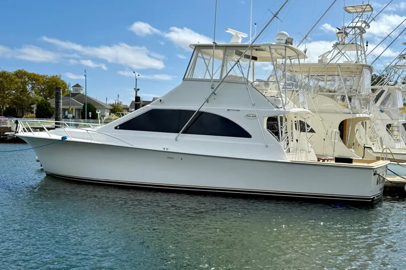  Yacht Photos Pics 2000 Ocean Yachts 48 model docked in a marina under a clear blue sky.
